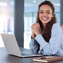 Woman smiling while working in office