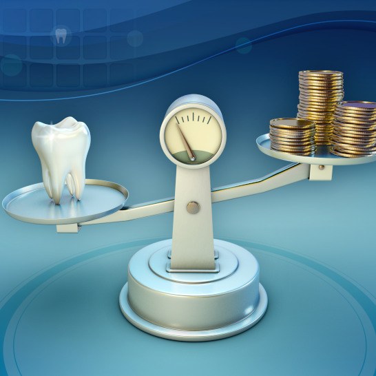 Tooth and coins on a balance scale